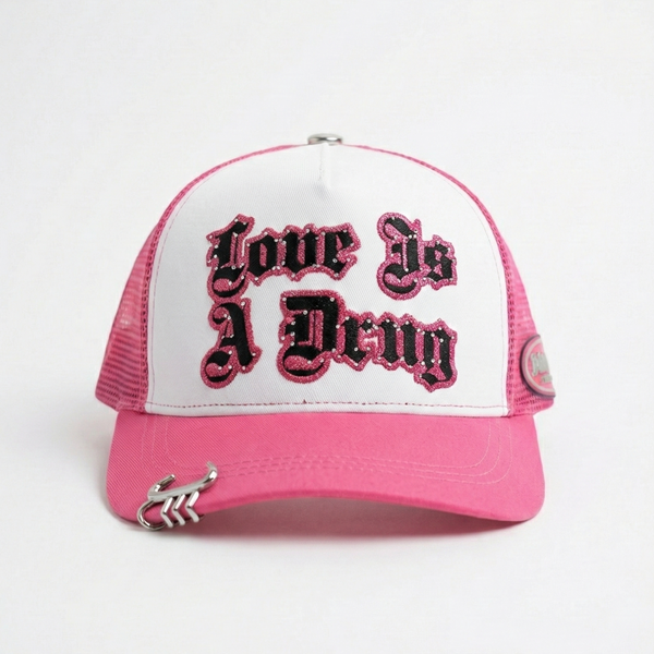 LOVE IS A DRUG TRUCKER HAT (PINK)